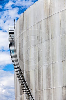 Abstract detail of a high and long stair case of an oil refinery