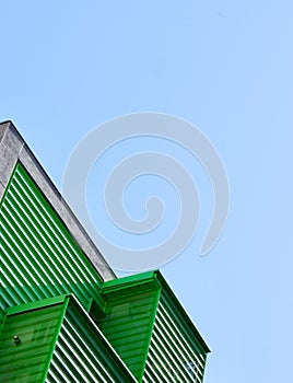 Abstract details of modern architecture. Corners of minimalistic construction of grey and green colours