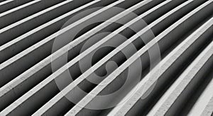 Abstract diagonal lines of light and shadow on a textured surface