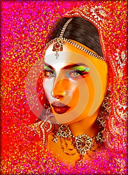 Abstract digital art of Indian or Asian woman's face, close up with colorful veil. An oil paint effect and glowing lights are