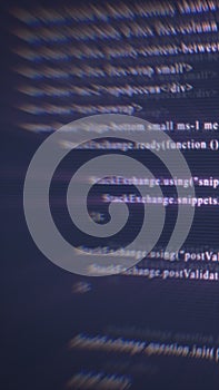 Abstract digital screen with blurred lines of code, symbolizing cybersecurity, data transmission, and information