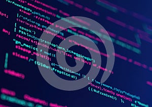 Abstract digital screen displaying glowing lines of computer code and programming language