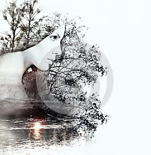 Abstract double exposure of woman and nature at the sunset on th