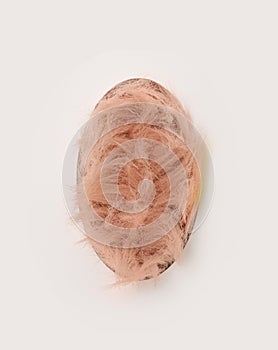 Abstract easter minimal concept. Fluffy baby pink color filled, unique egg shaped , against offwhite background photo