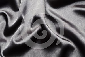 Abstract, elegant background texture with waves of silk fabric