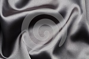Abstract, elegant background texture with waves of silk fabric