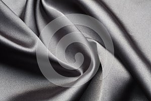 Abstract, elegant background texture with waves of silk fabric