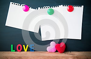 Abstract empty paper note with Red and Pink Heart Knitting on blackboard background. valentine greeting card copy space for add