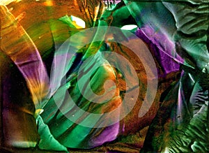 Abstract encaustic wax background in green, lila, orange color white phantasm eyes