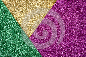 Abstract festive luxury glitter background - geometric composition in golden, green and purple colours with copy space