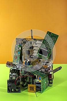 Abstract figure folded from computer circuit boards on a colored background