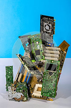 Abstract figure folded from computer circuit boards on a colored background