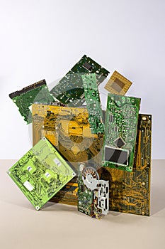Abstract figure folded from computer circuit boards on a colored background