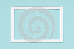 Abstract flat lay pastel blue colored paper texture minimalism background. Template with empty picture frame mock up.