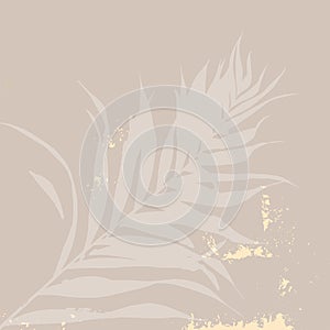 Abstract floral beige tropical leaves background with a touch of gold foil texture