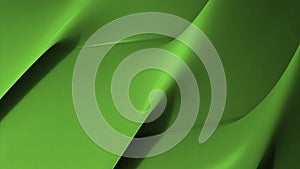 Abstract flowing green folds background. Design. Colorful slowly flowing texture with folds creating shadows.