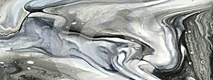 Abstract fluid art background black and cool gray colors. Liquid marble. Acrylic painting on canvas with silver gradient