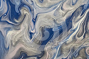 Abstract fluid art background blue and silver colors. Liquid marble. Acrylic painting with gray glitter and gradient