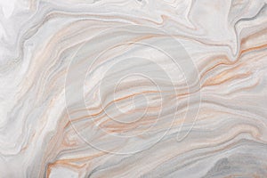 Abstract fluid art background brown and white colors. Liquid marble. Acrylic painting with gray gradient and splash