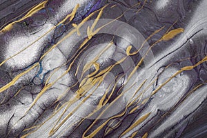 Abstract fluid art background dark gray and silver colors. Liquid marble. Acrylic painting on canvas with golden lines