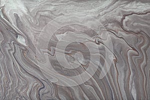 Abstract fluid art background dark gray and silver colors. Liquid marble. Acrylic painting with grey gradient