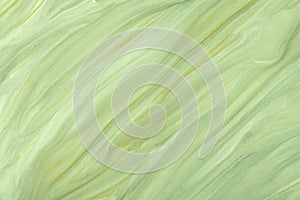 Abstract fluid art background light green and olive colors. Liquid marble. Acrylic painting with khaki pearl gradient