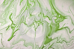 Abstract fluid art background light green and white colors. Liquid marble. Acrylic painting with olive gradient