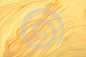 Abstract fluid art background light yellow and golden colors. Liquid marble. Acrylic painting with beige pearl gradient