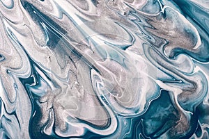 Abstract fluid art background navy blue and silver colors. Liquid marble. Acrylic painting with gray gradient