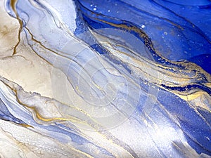 Abstract fluid blue background with gold. Liquid abstraction. Alcohol ink art resembles sea, watercolor or aquarelle.