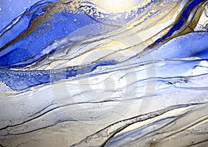 Abstract fluid blue background with gold. Liquid abstraction. Alcohol ink art resembles sea, watercolor or aquarelle.
