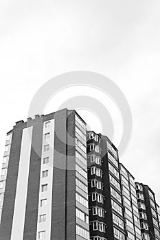 Abstract fragment of contemporary architecture. Residential modern building, dramatic black and white, copy space, vertical photo