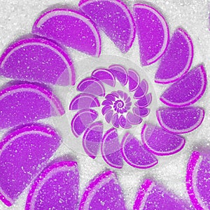 Abstract fruit jelly wedges cantle lobule on white sugar background. Violet jellies. Abstract fruit jelly on white sugar backgrou