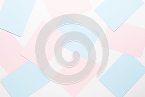 Abstract geometric background in light pastel tones from sheets of thick pale past paper