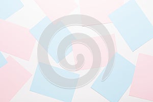 Abstract geometric background in light pastel tones from sheets of thick pale past paper