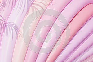 Abstract geometric background with rings or circles in pastel pink colors with tropical leaf shadow, 3d render