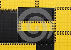 Abstract geometric composition of black rectangles and yellow grid pattern isolated on white background
