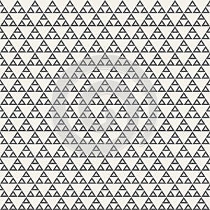 Abstract geometric monochrome seamless pattern with triangles.