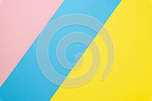 Abstract geometric paper background. Blue, pink and yellow trend colors. Flat lay.Top view