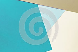 Abstract geometric paper background of pastel brown, blue and beige colors