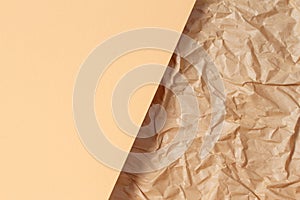 Abstract geometric paper texture background. Blank beige color paper sheet over recycle crumpled brown paper background