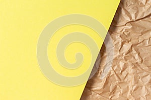 Abstract geometric paper texture background. Blank yellow color paper sheet over recycle crumpled brown paper background