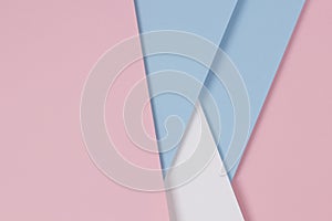 Abstract geometric pastel color paper texture background with light blue, pink and white colors