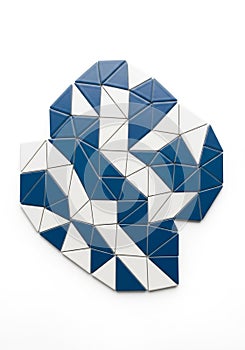 An abstract geometric pattern composed of small triangular tiles. The