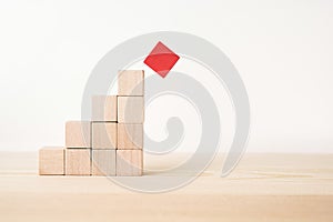 Abstract geometric real wooden cube pyramid on white floor background and it`s not 3D render. It`s the symbol of make a mistake,
