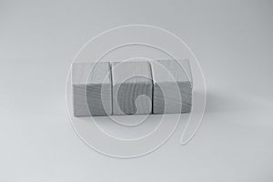 Abstract geometric real wooden cube with surreal layout on grey background
