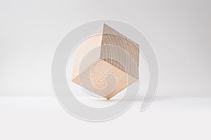 Abstract geometric real wooden cube with surreal layout on white background