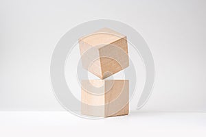 Abstract geometric real wooden cube with surreal layout on white background