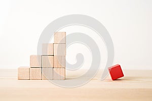 Abstract geometric real wooden cube with surreal layout on white floor background and it`s not 3D render. It`s the symbol of opp