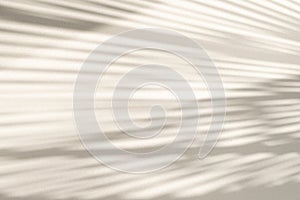 Abstract geometric shadows on grey, gold or yellow natural material wall., background. Sunny warm background